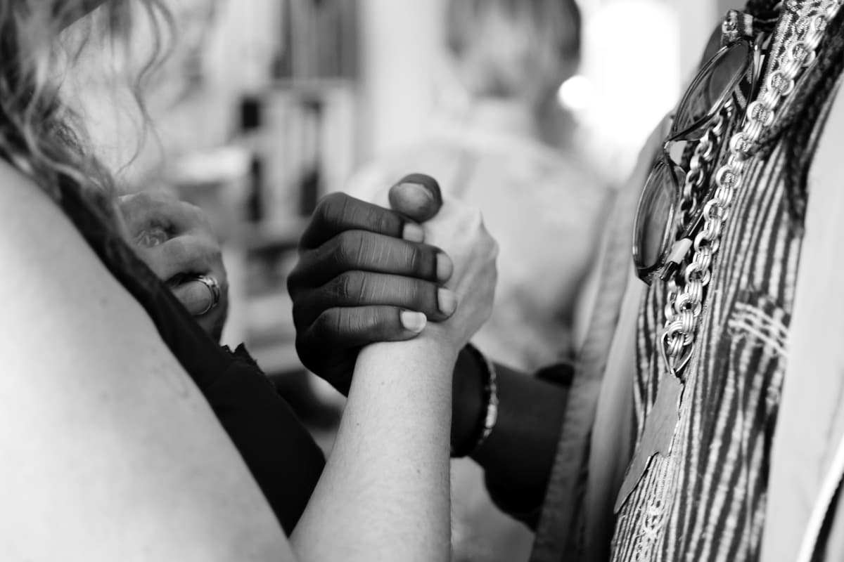 Two people hand in hand